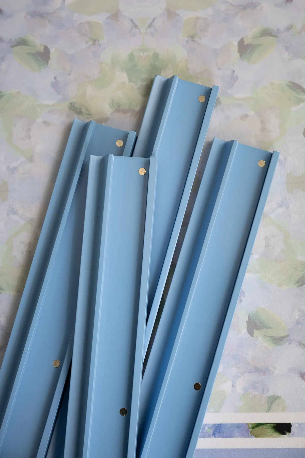 Clear acrylic mahjong racks and attached pushers resting on a flat surface