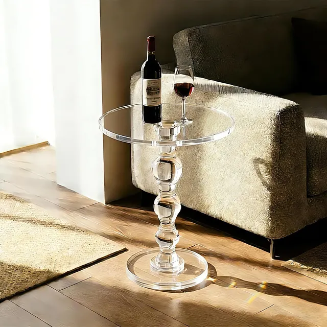 Clear acrylic side table with slim legs and square top.