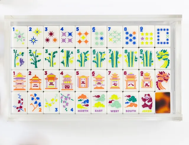 Tiles with warm amber Tourtise Shell pattern in white and ink.