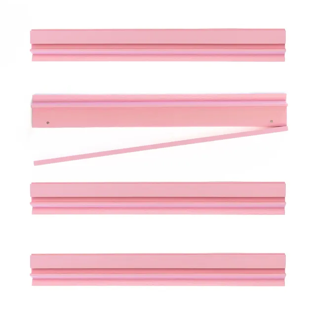 Four pink wooden Mahjong racks by Bam Bird Boutique.