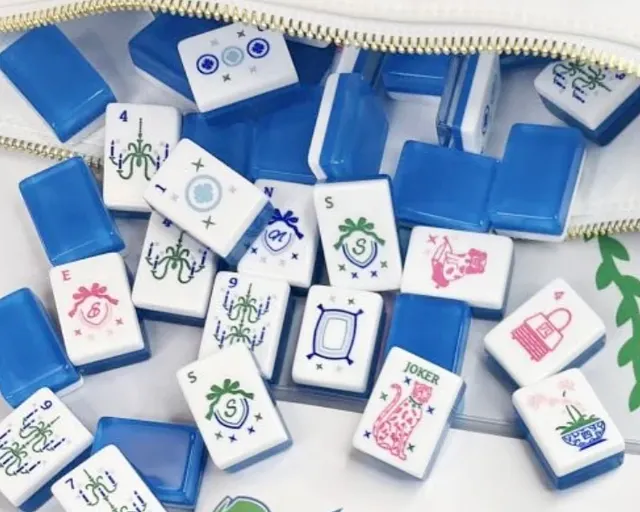 Blue Grandmillenial tiles with ivory pips and beveled edges