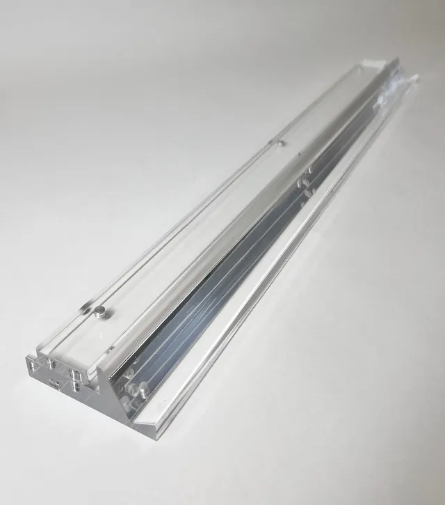 Clear acrylic rack, 20 inches long, with beveled edges.
