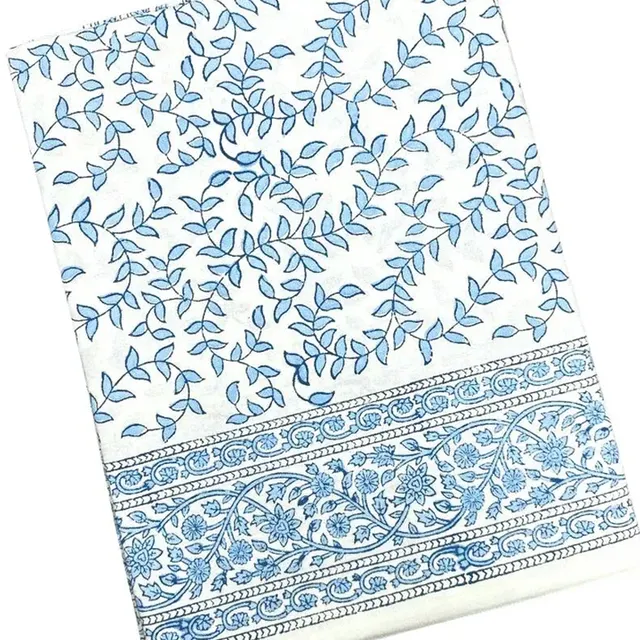 Blue Leaves Tablecloth with a pale backdrop and blue leaf motif.