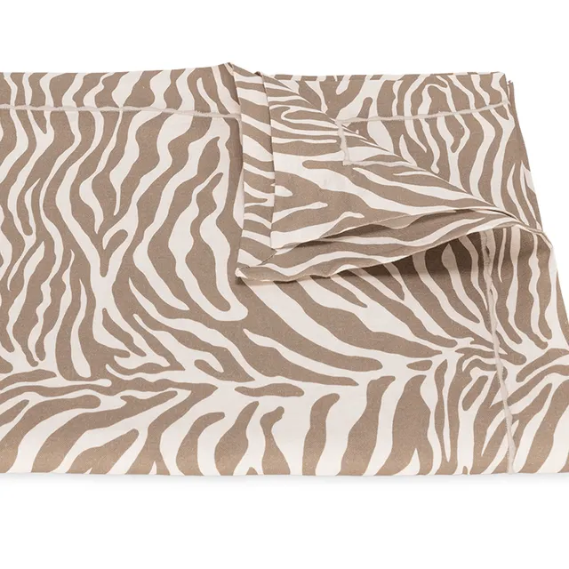 Matouk Regine Tablecloth in Coconut with zebra motif.