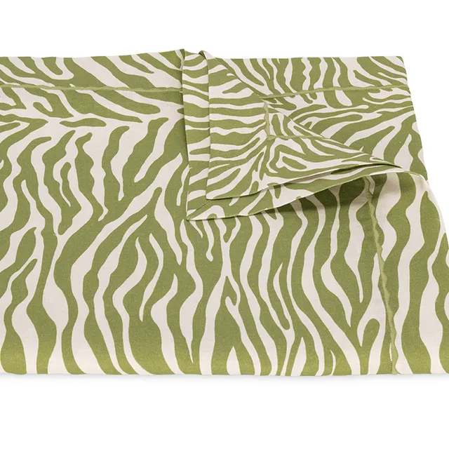 Matouk Regine Grass Green tablecloth with tailored edge and subtle sheen.