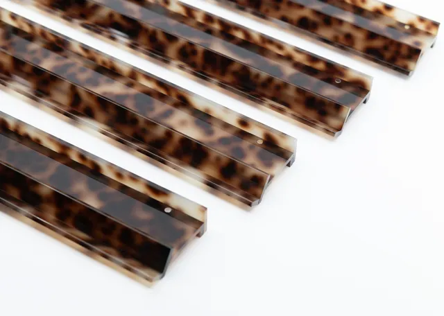Blonde tortoise rack by Miss Mahjong in warm amber acrylic.