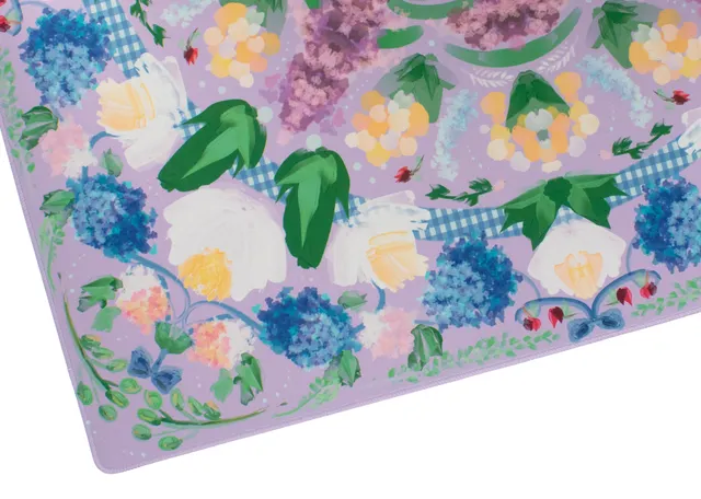 Lavender garden-themed mat with quilted surface and lilac border.