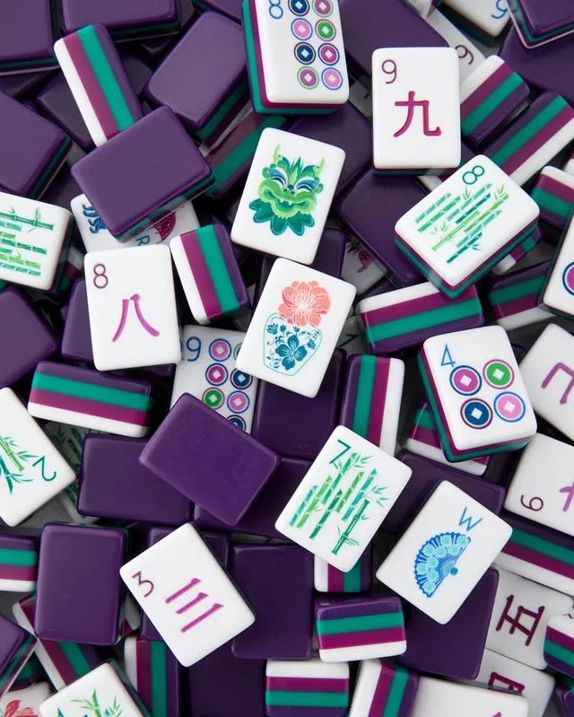 Gemma Tiles by Oh My Mahjong in cream ceramic with gem-toned inlays.