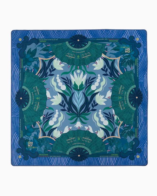 Jade-green mahjong mat rolled inside a slim tube.