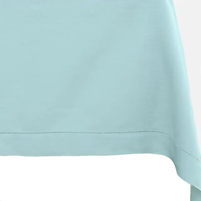 Aqua blue linen tablecloth with subtle slub texture and clean hems.