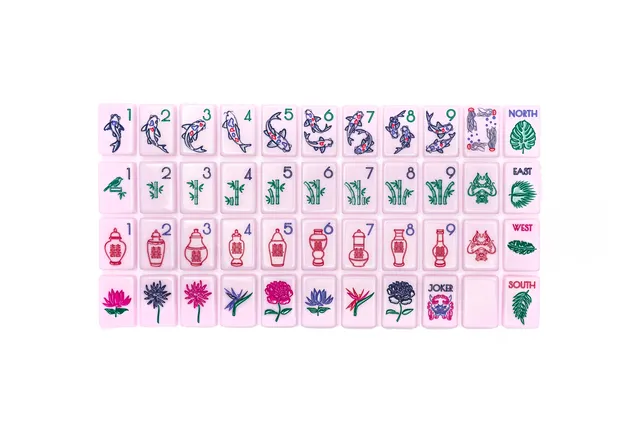 The Chinoiserie Set Polished Pink tile collection with ivory accents.
