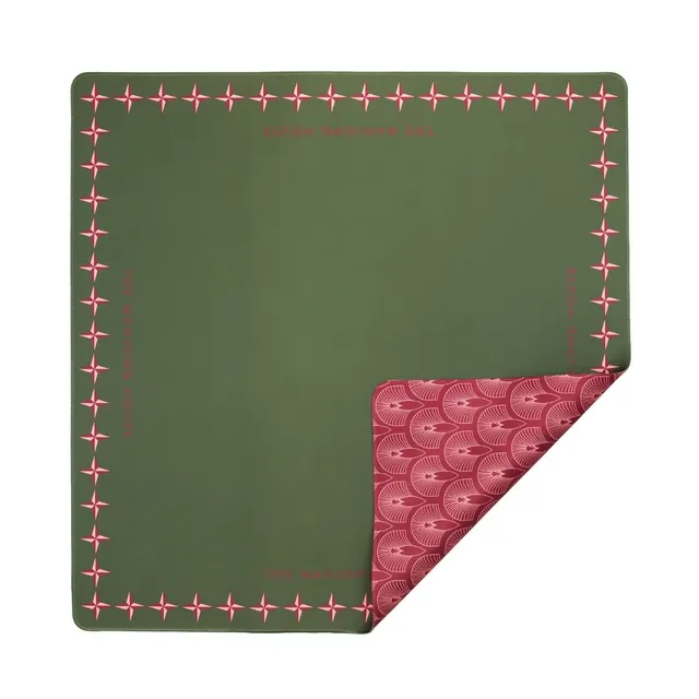 Double-sided mat with red and olive faces and a non-slip backing.