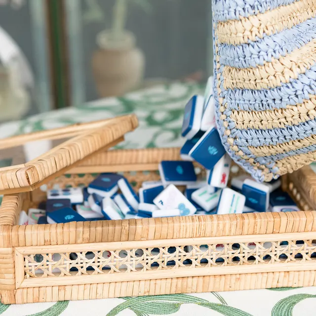 Lidded handwoven rattan tile box with natural honey finish.