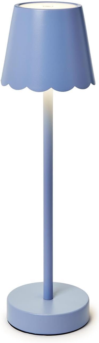Cordless scalloped-edge lamp in cornflower blue with warm glow.